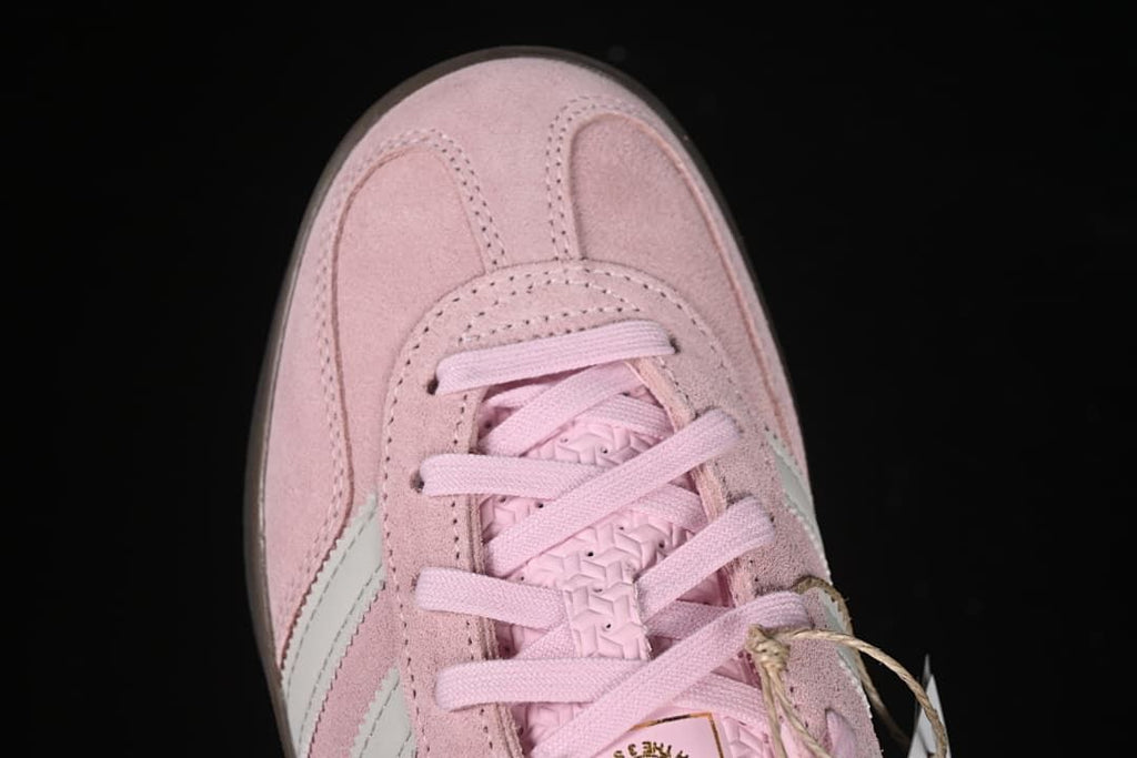 Top-down detail of the sneaker toe and lacing