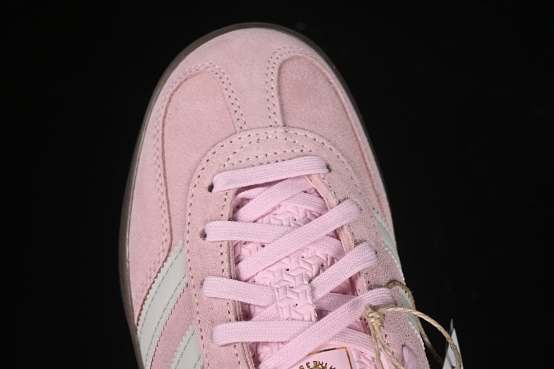 Top-down detail of the sneaker toe and lacing