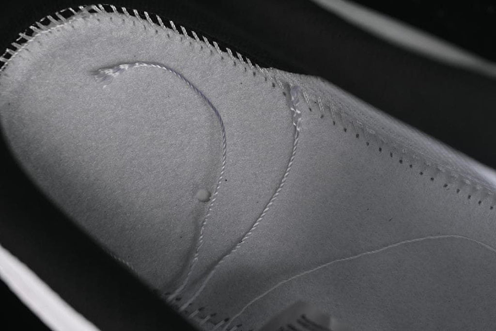 Close-up of stitching and panel details on the sneaker upper
