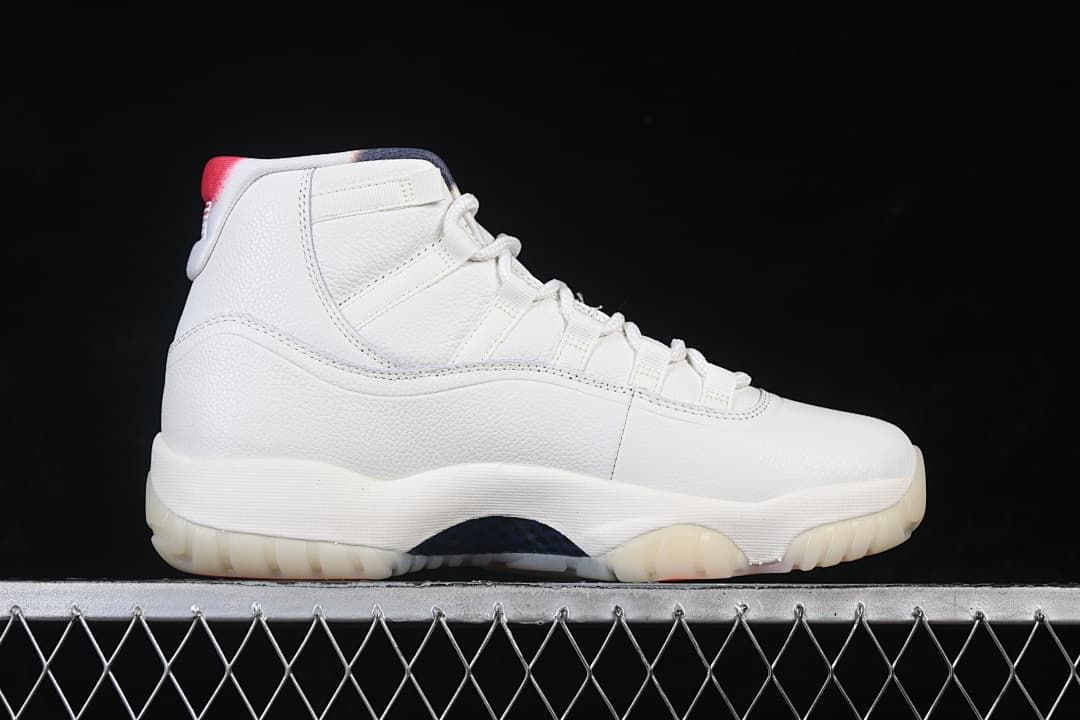 Side profile of a white Air Jordan 11 Retro high-top sneaker.