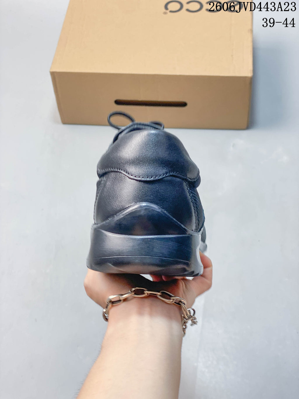 Rear view of the navy sneaker showing the heel and sole