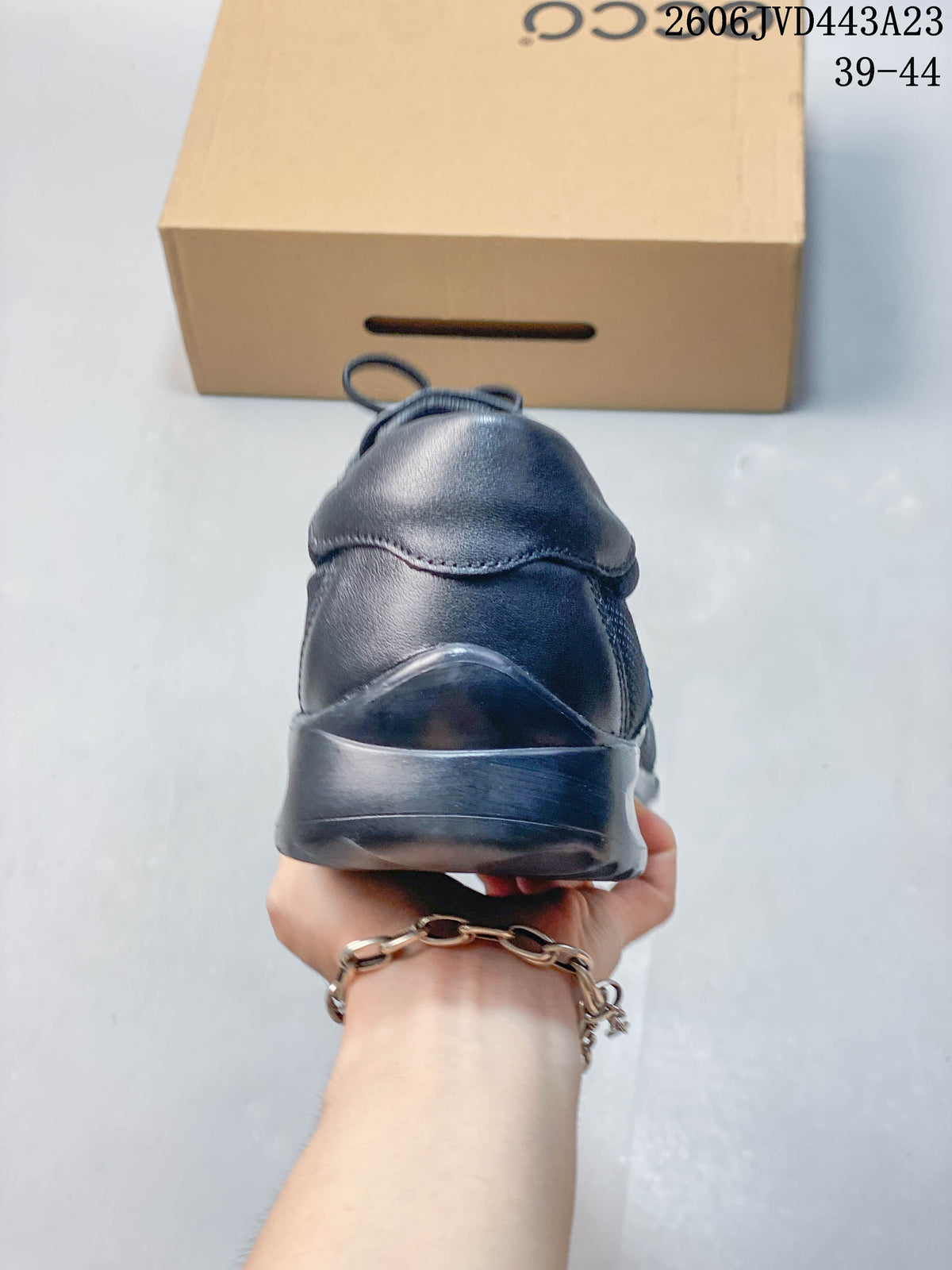 Rear view of the navy sneaker showing the heel and sole