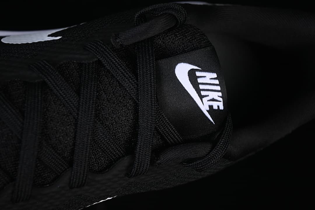 Close-up of black laces and tongue label with Nike branding