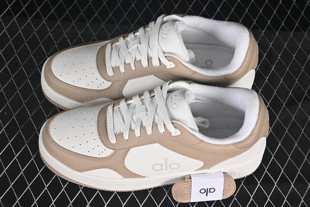 Pair of white and beige low-top sneakers shown from above