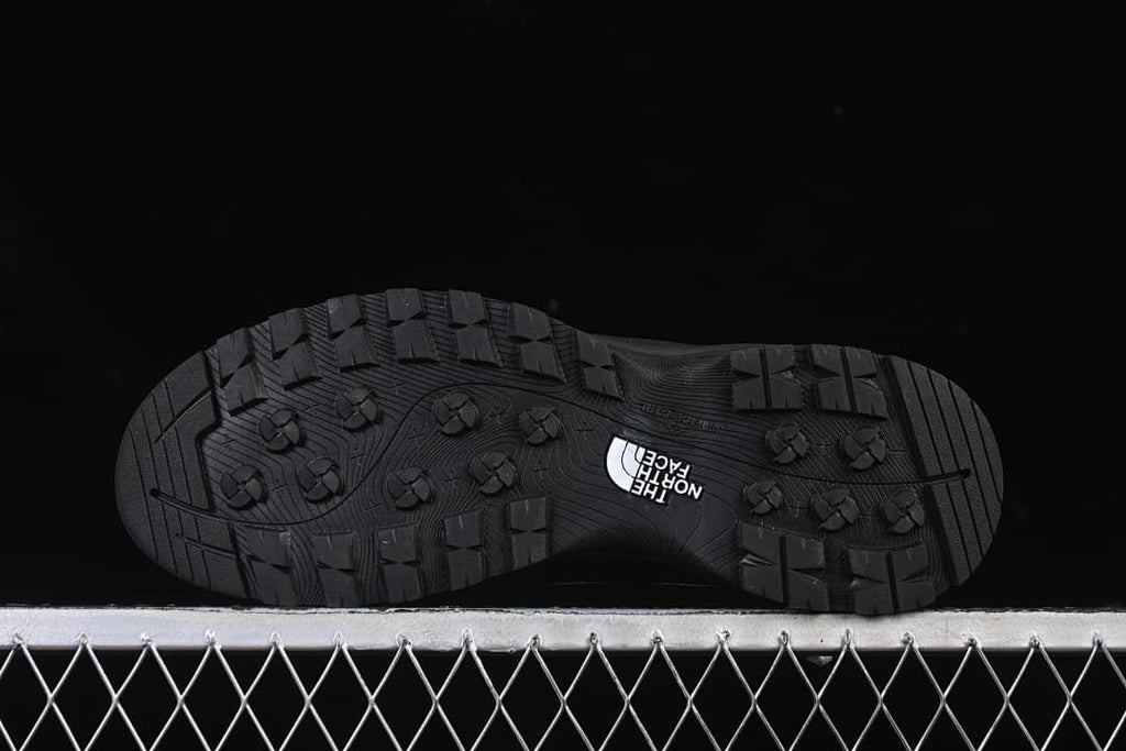 Underside view showing the tread pattern on the black outsole