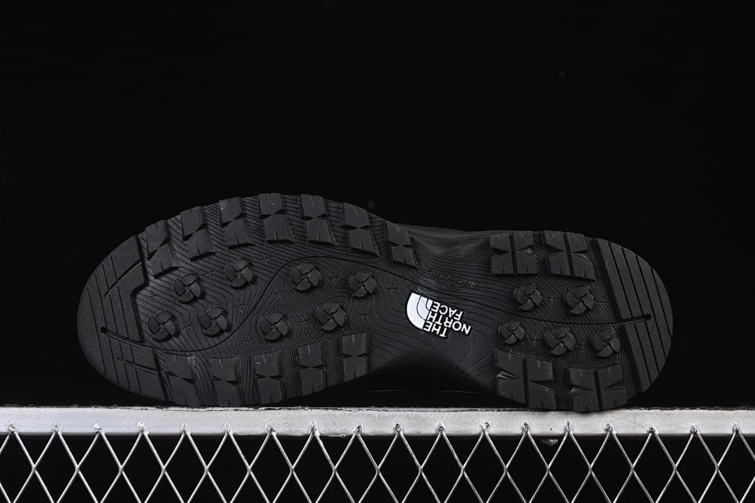 Underside view showing the tread pattern on the black outsole