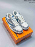 White, grey and blue low-top sneakers shown from above on an orange shoe box.