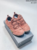 Pair of dusty rose New Balance MT10O low-top sneakers on a gray shoe box
