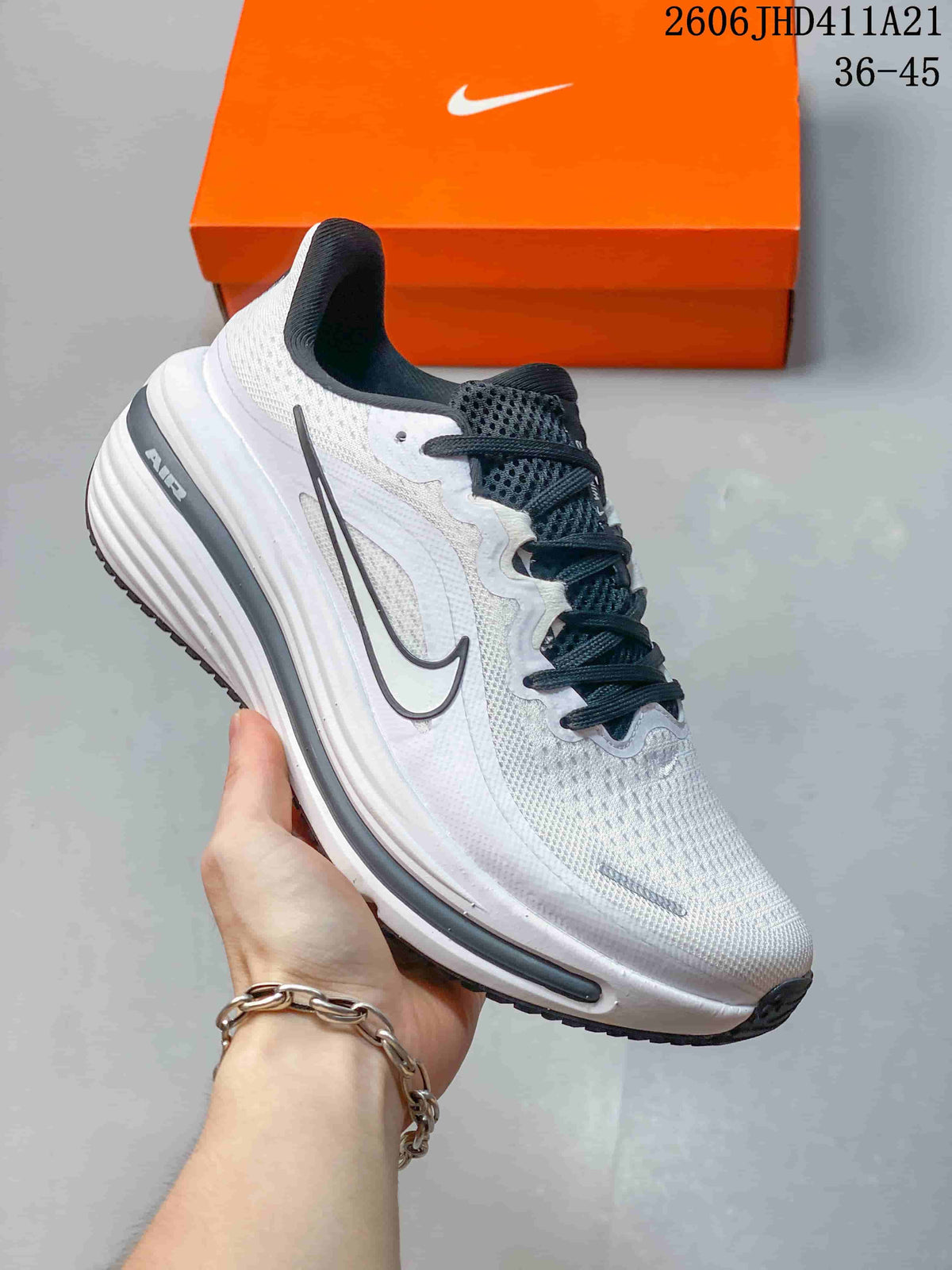 Angled side view of a white Nike Air Zoom Winflo 12 running shoe with a dark Swoosh