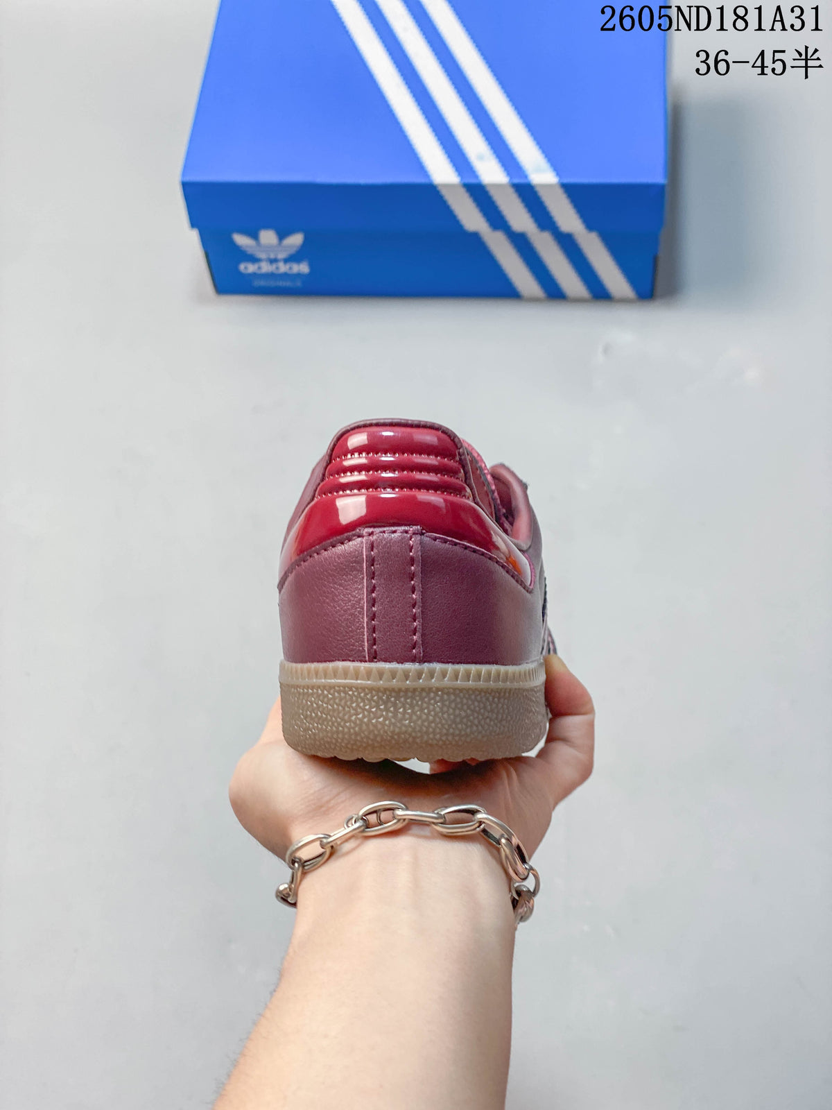 Rear view showing the burgundy heel and gum-colored outsole