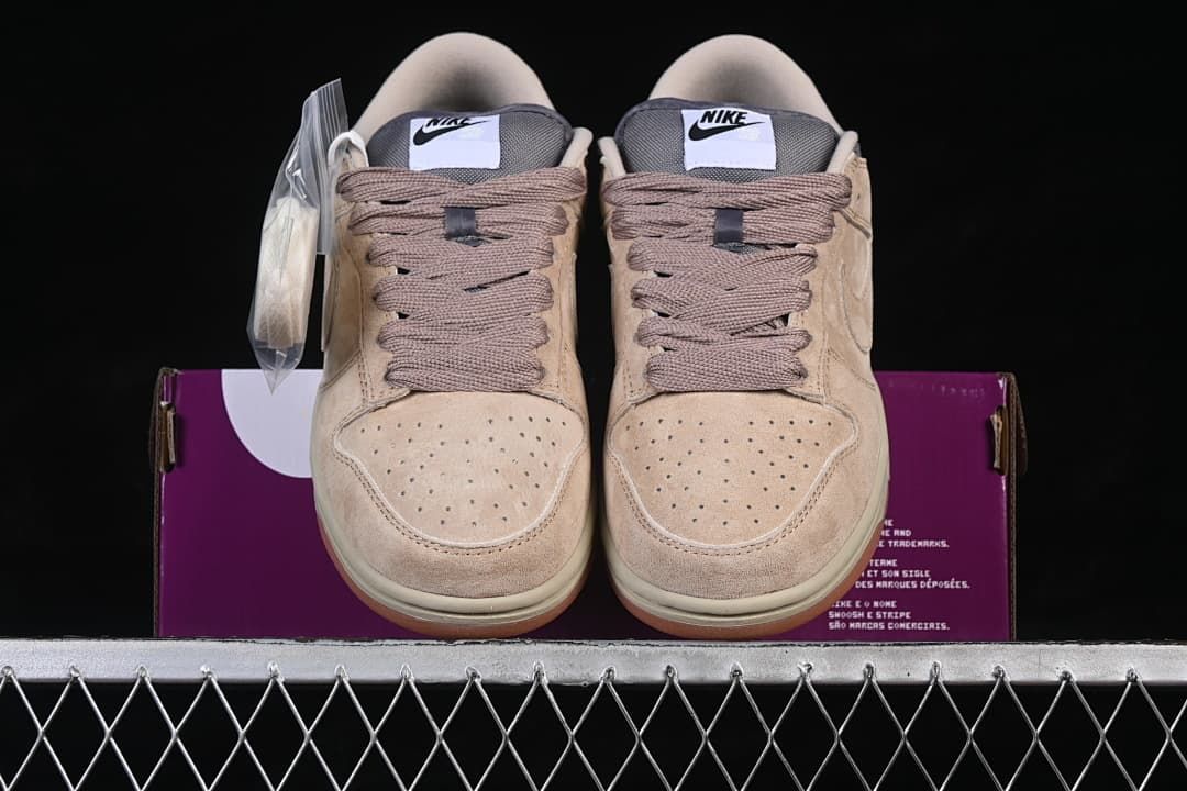 Front view of both sneakers, showing perforated toe boxes and brown laces