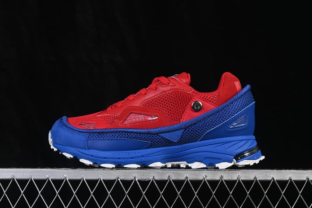 Side profile of the red and blue low-top sneaker