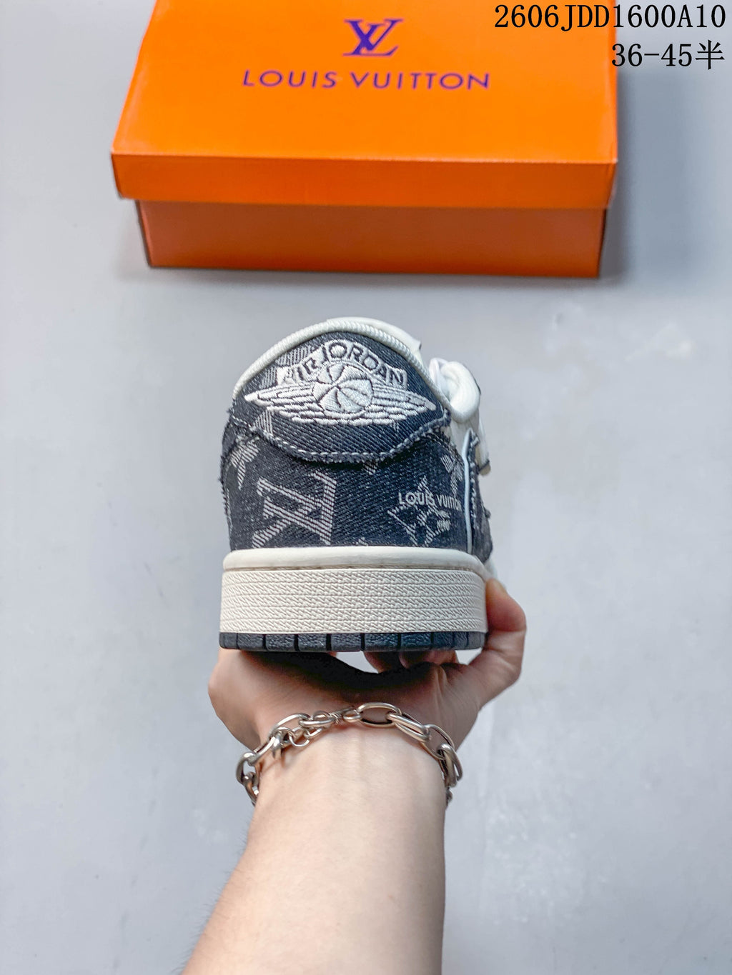 Rear view showing the patterned heel panel and embroidered winged basketball emblem