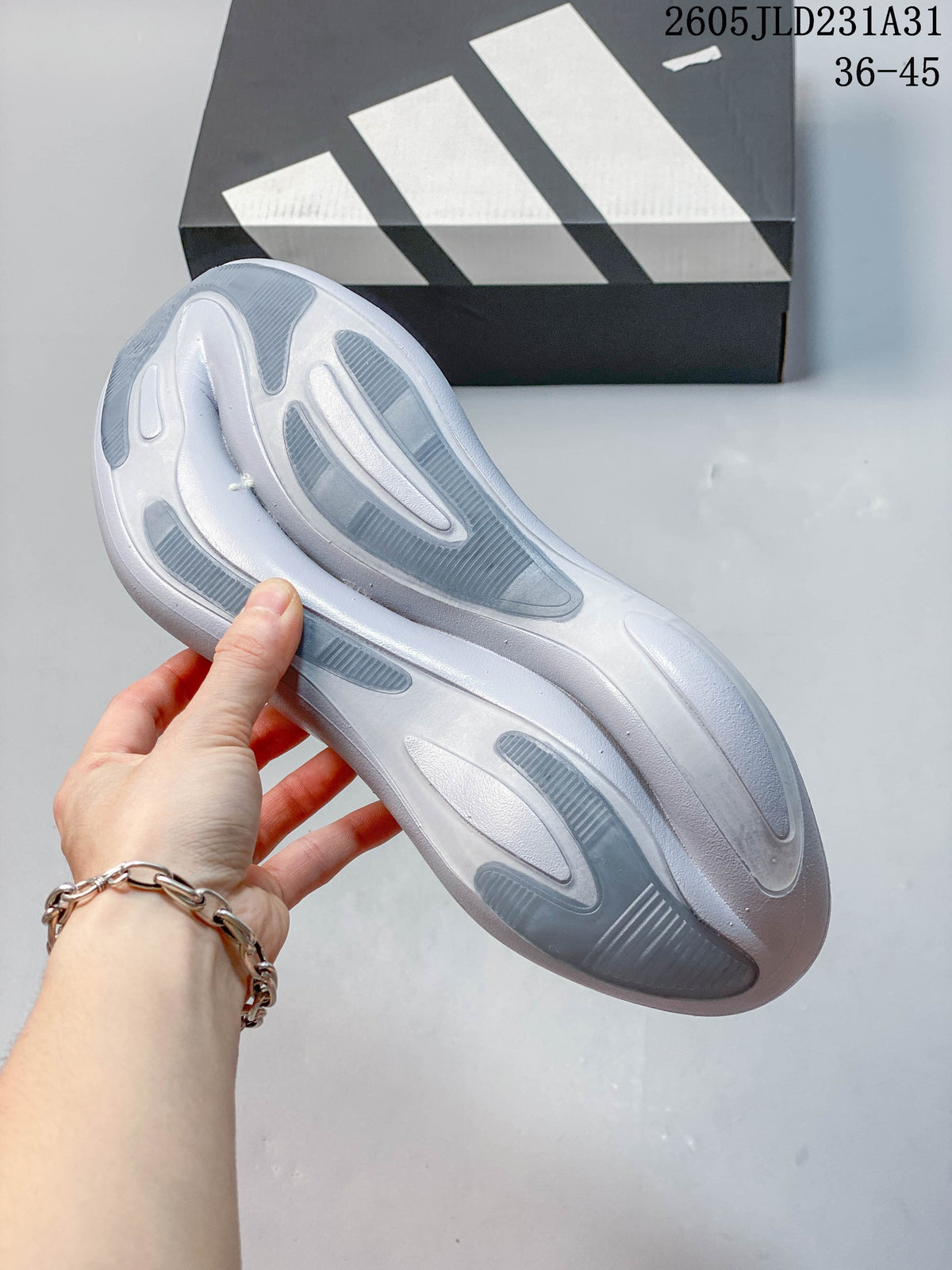 Underside view of a Adidas Hyperboost sneaker showing the patterned grey and white outsole.