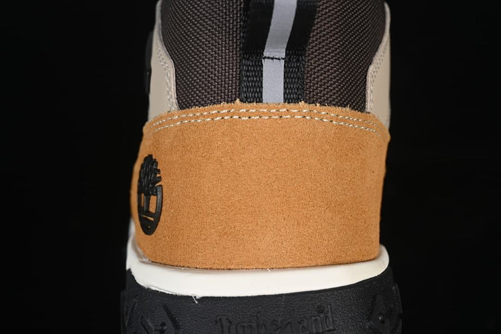 Rear close-up of the tan heel panel and black outsole