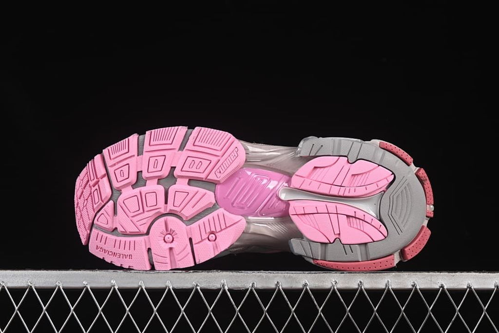 Underside view showing the pink and gray patterned outsoles.