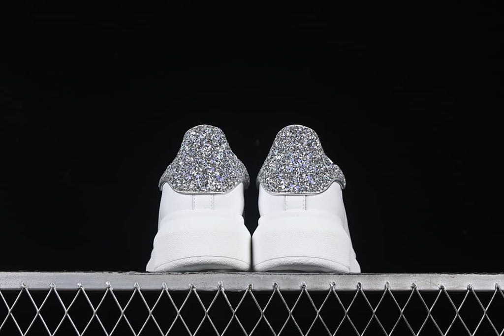 Rear view of the pair highlighting the glitter heel panels.