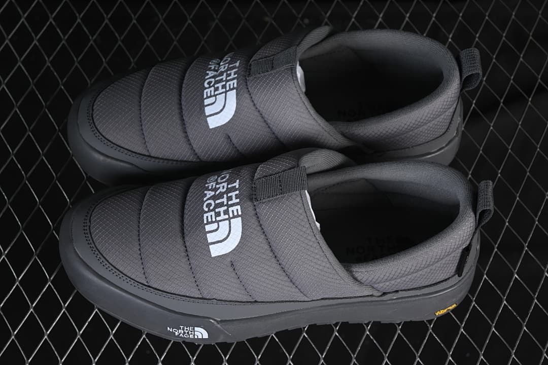 Pair of grey slip-on shoes viewed from above