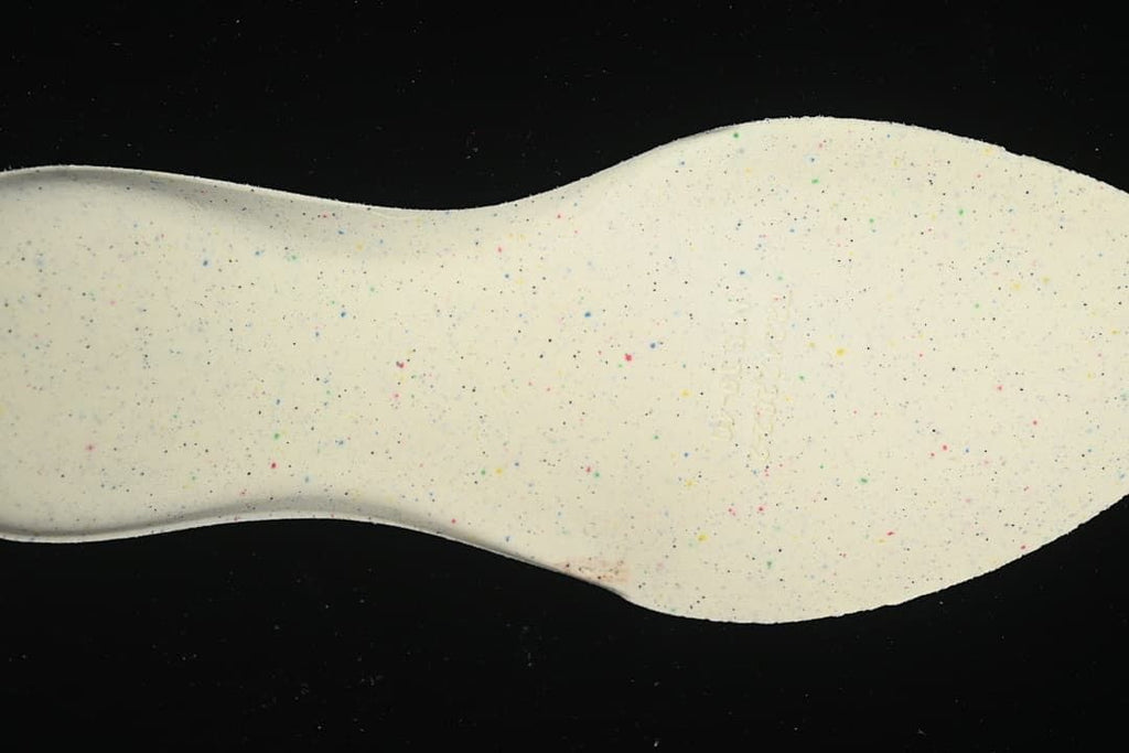 Close-up of the light-colored speckled shoe sole