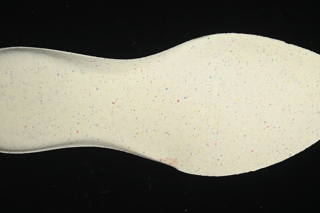 Close-up of the light-colored speckled shoe sole