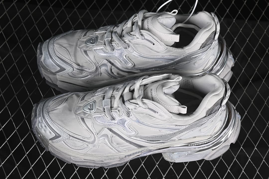 Pair of grey and silver sneakers shown from above.