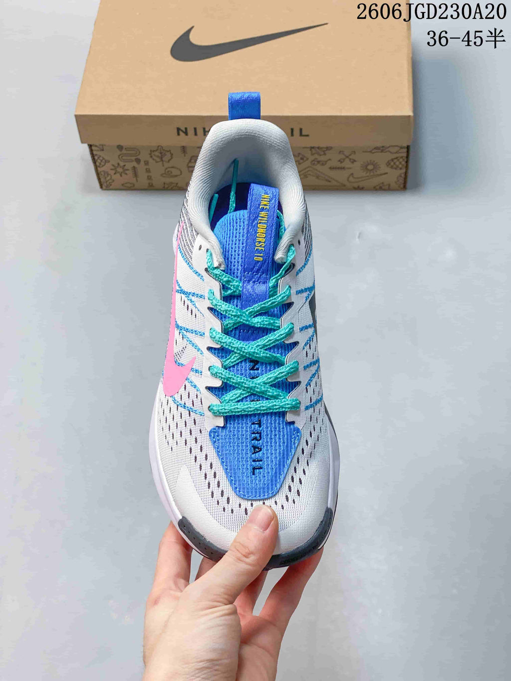 Top view of the Nike Wildhorse 10 shoe, showing its blue tongue, turquoise laces, and perforated white upper.