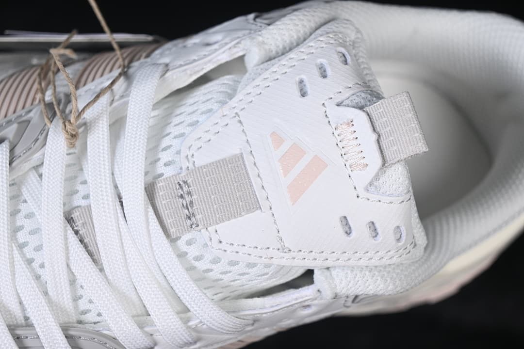 Close-up of the tongue, lace area and adidas mark