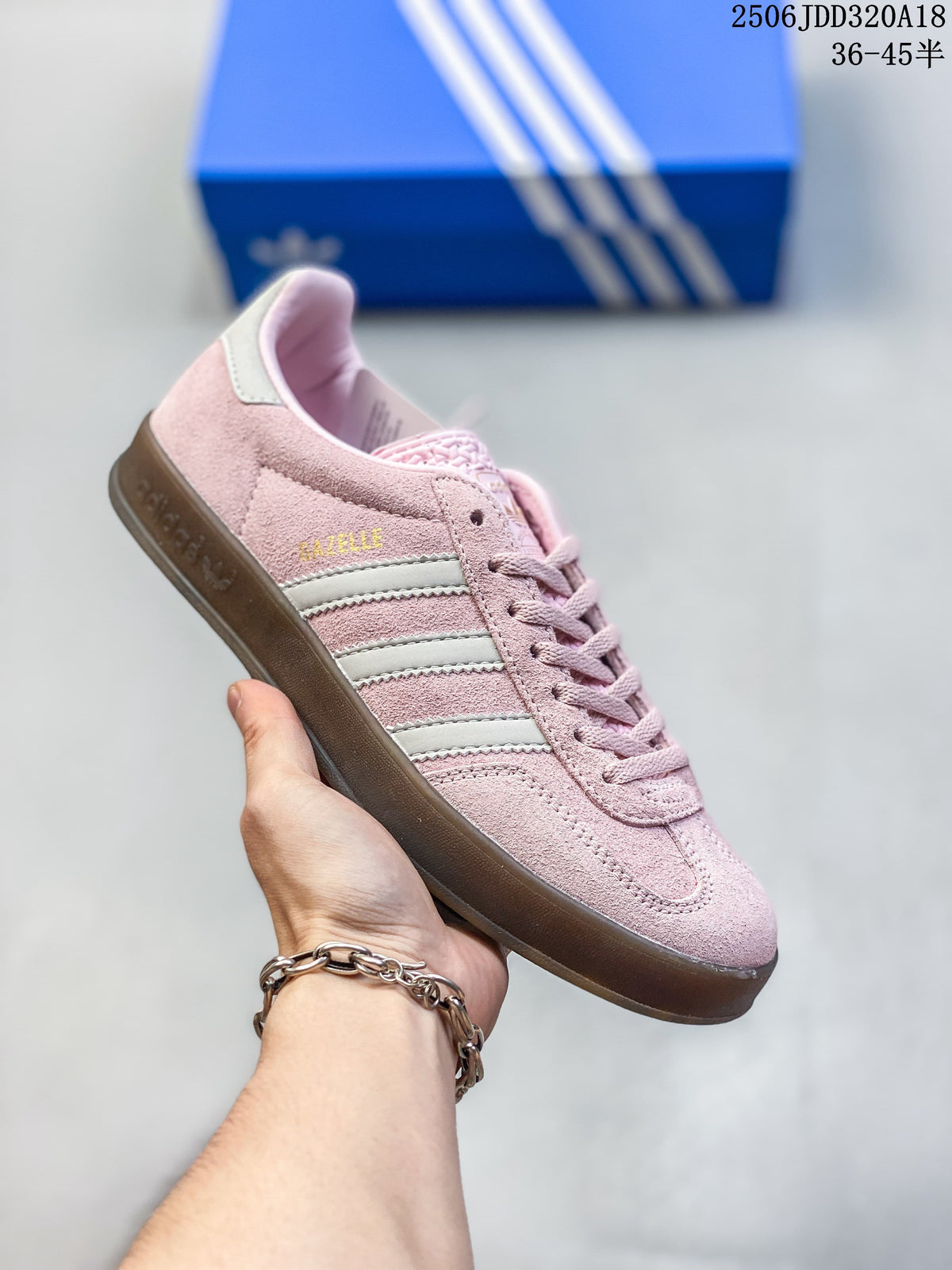 Pink Adidas Gazelle 90 sneaker with cream stripes and a dark gum-style sole
