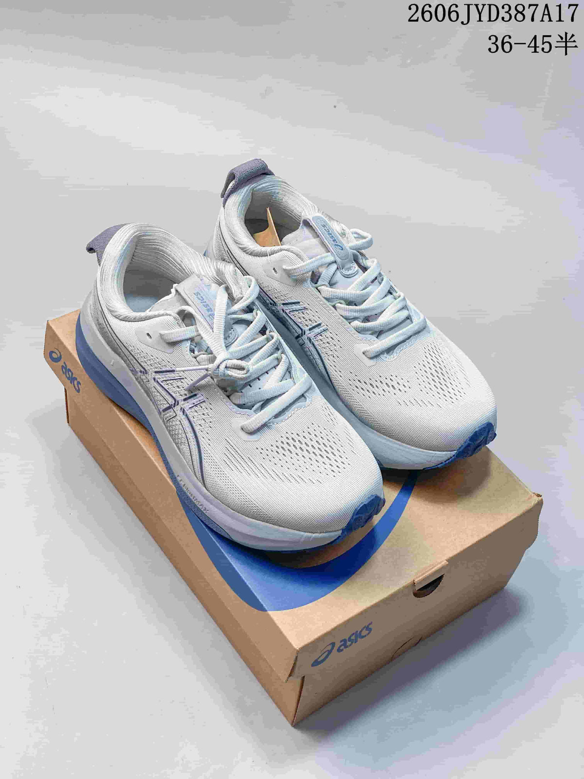 Pair of white and blue ASICS Gel-Kayano 33 running shoes displayed on a shoebox