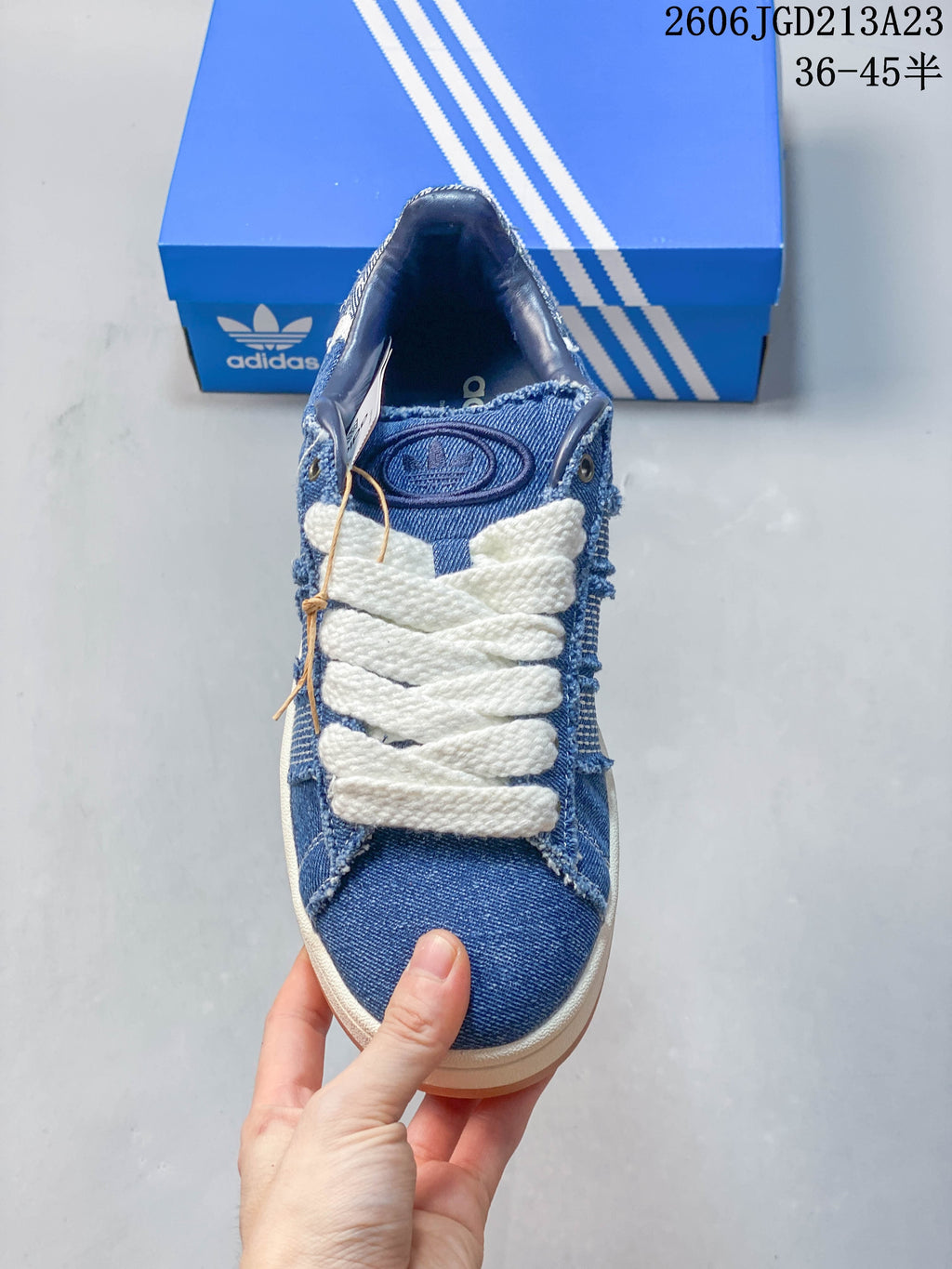 Top view showing the blue denim-style upper and oversized white laces.