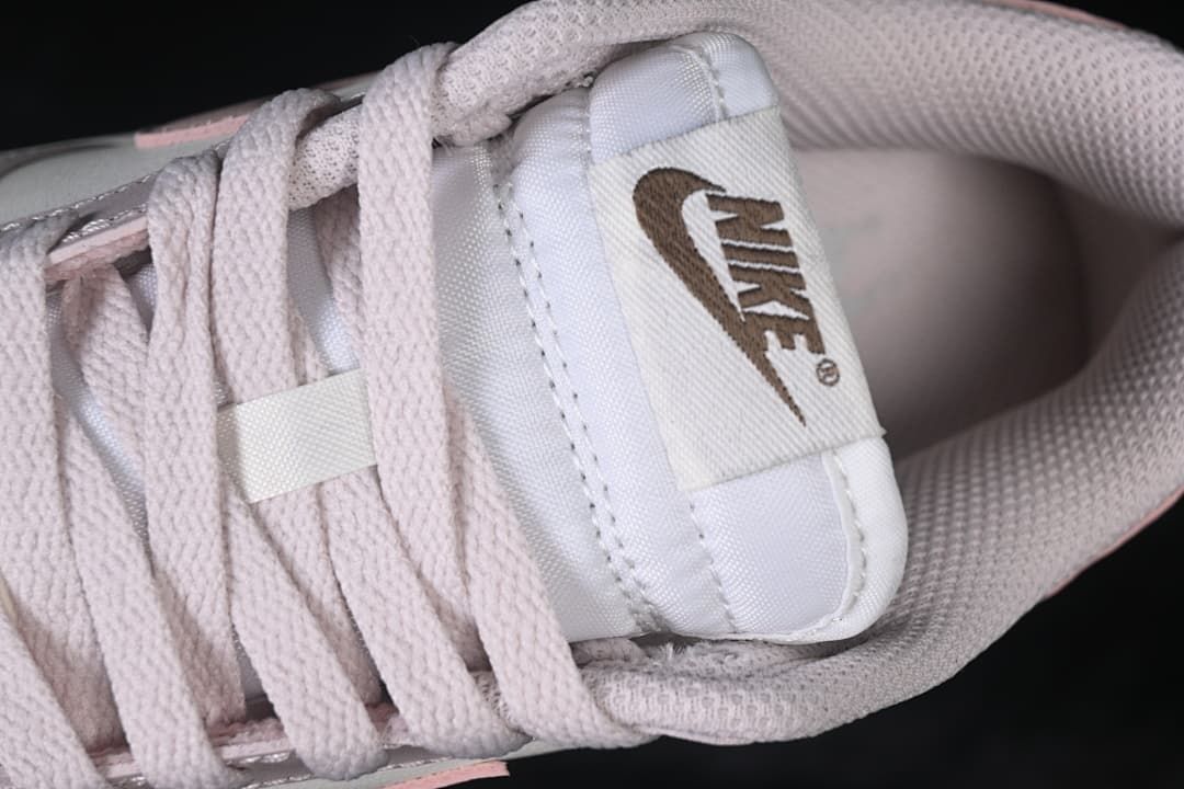 Close-up of the tongue label and pale pink laces