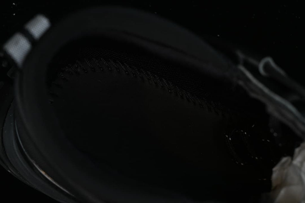 Dark close-up view inside the sneaker