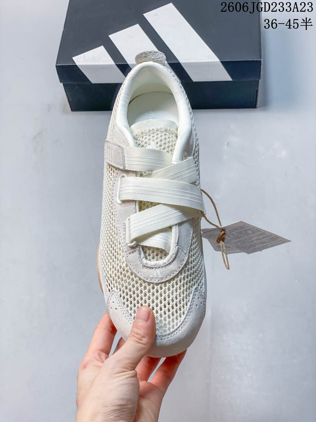 Top view of an off-white adidas Urban Reverie sneaker showing its rounded toe and strap-style closures