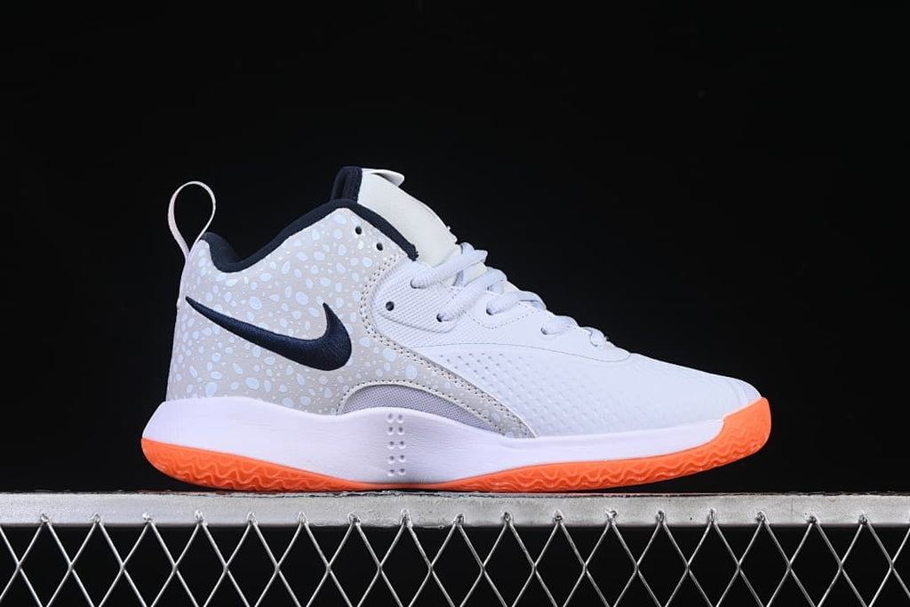 Side profile showing the low-top silhouette and orange outsole