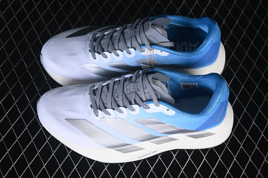 Pair of white, blue, and silver adidas Adizero Evo SL running shoes viewed from above.