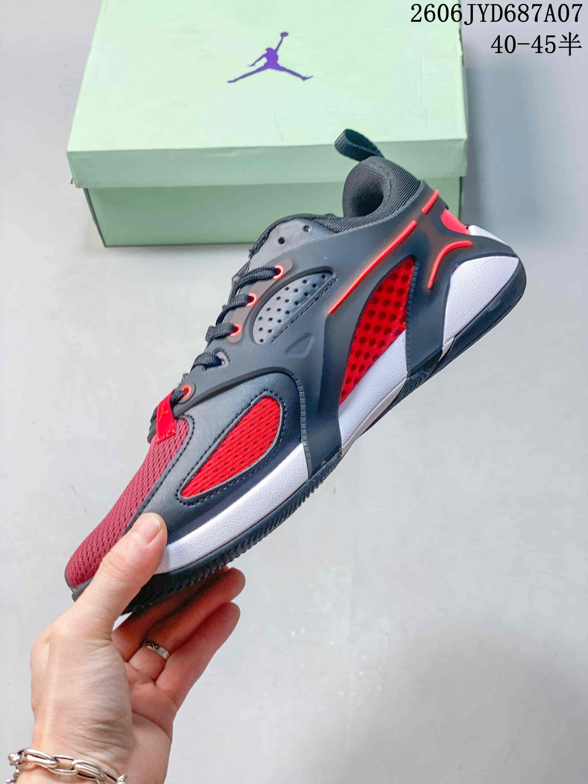 Side view of a dark gray and red Jordan Heir PF basketball shoe