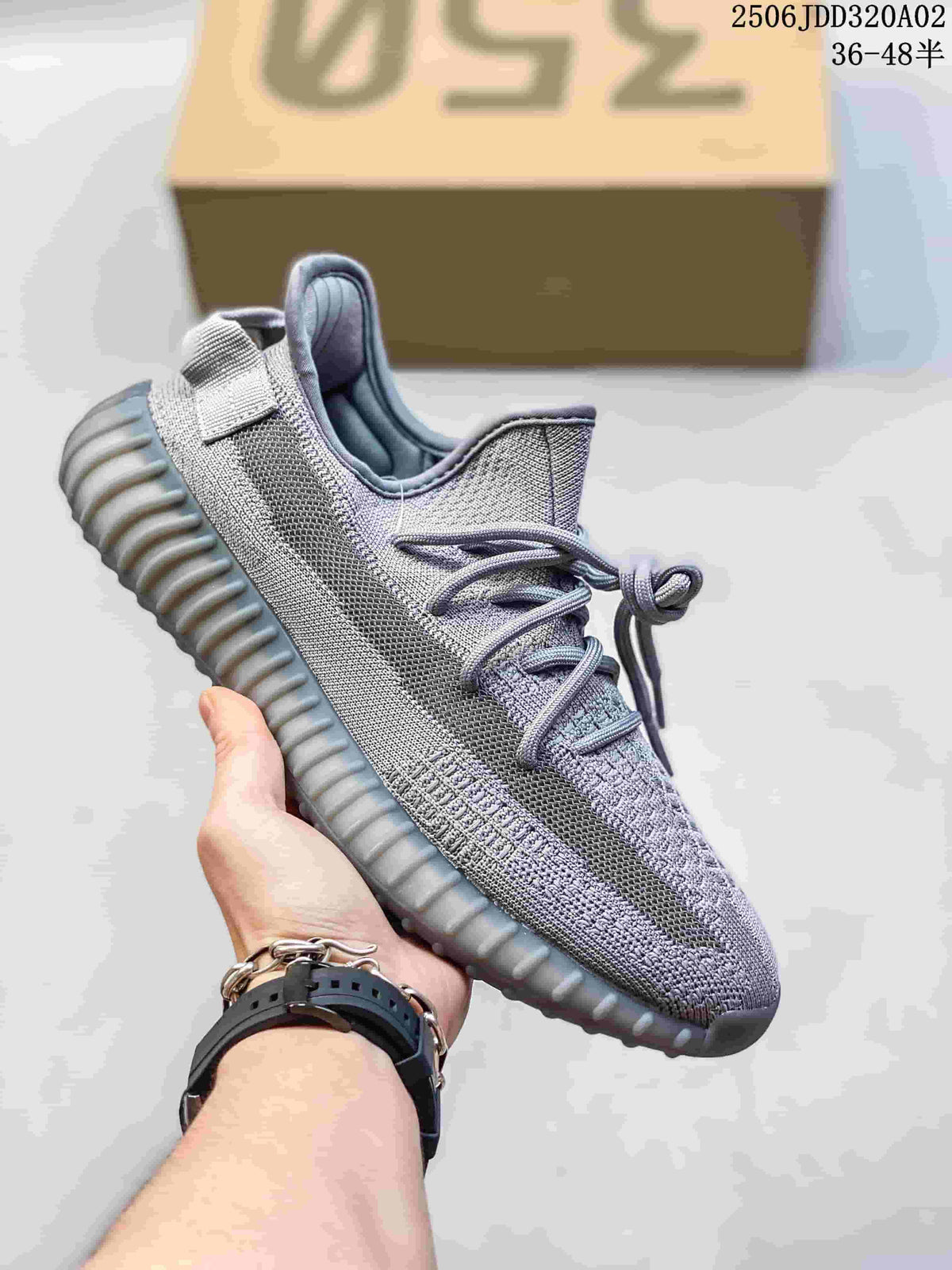Gray knit-look Adidas Yeezy-style sneaker with a ribbed gray sole