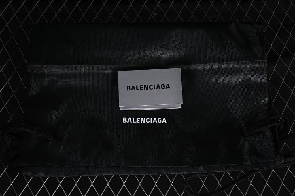 Black Balenciaga drawstring bag and printed card