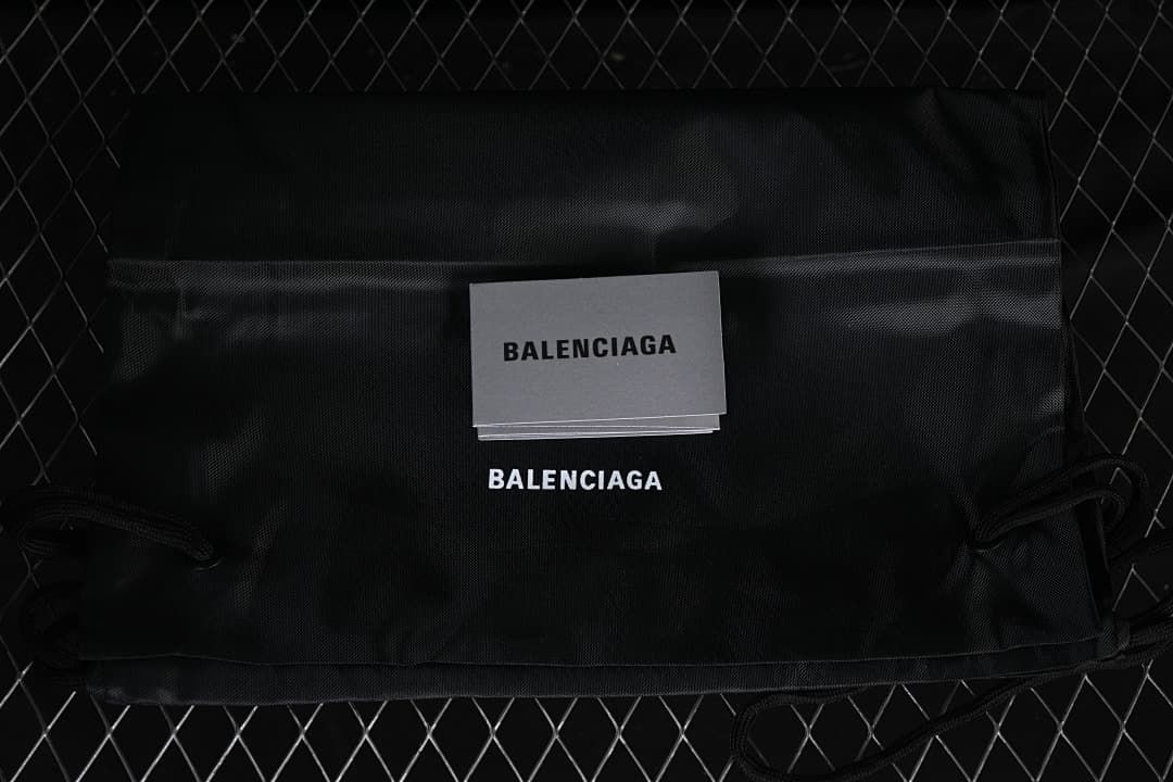 Black Balenciaga drawstring bag and printed card
