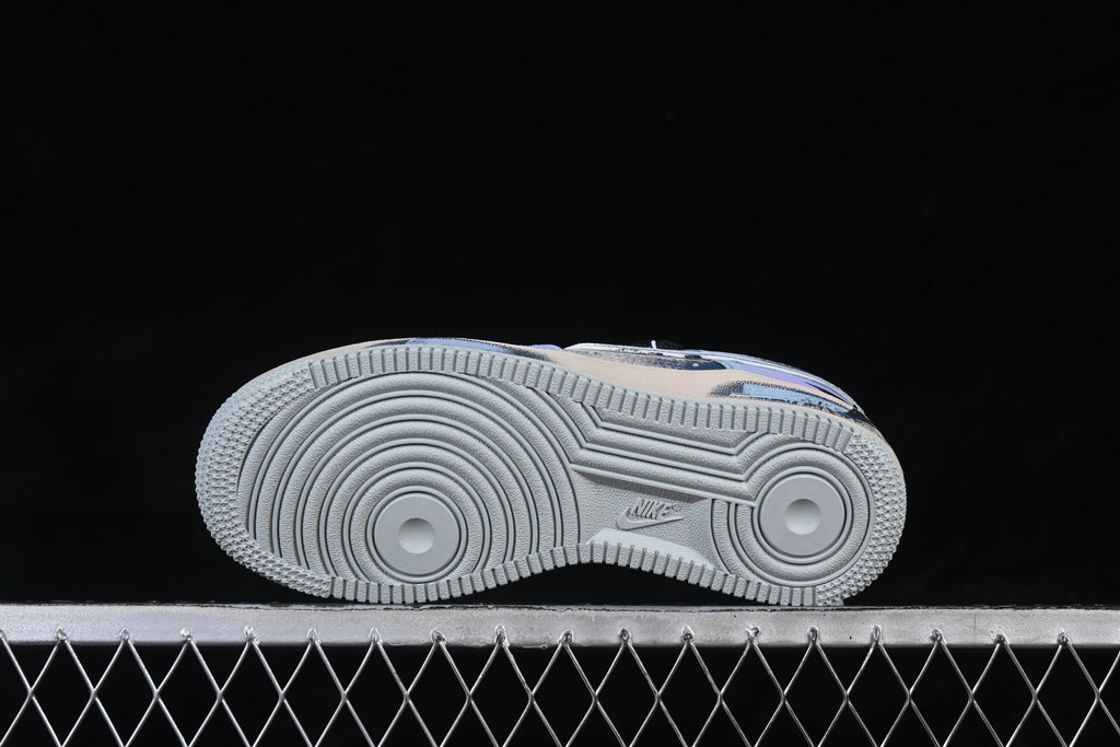 Underside view of the sneaker showing the circular-patterned outsole