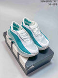 Pair of white and teal Adidas HYPERBOOST EDGE M sneakers displayed on a shoebox
