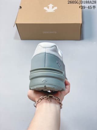 Rear view showing the heel and layered sole of the white and blue-gray shoe; box marking includes 39–45.