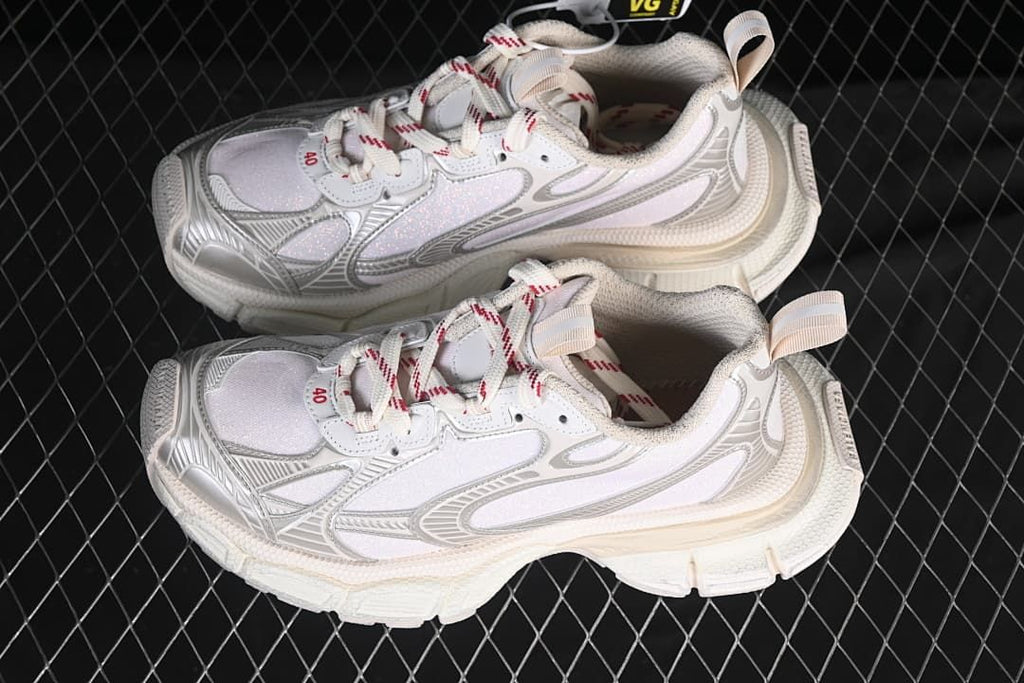 Pair of beige and silver sneakers shown from above and the side