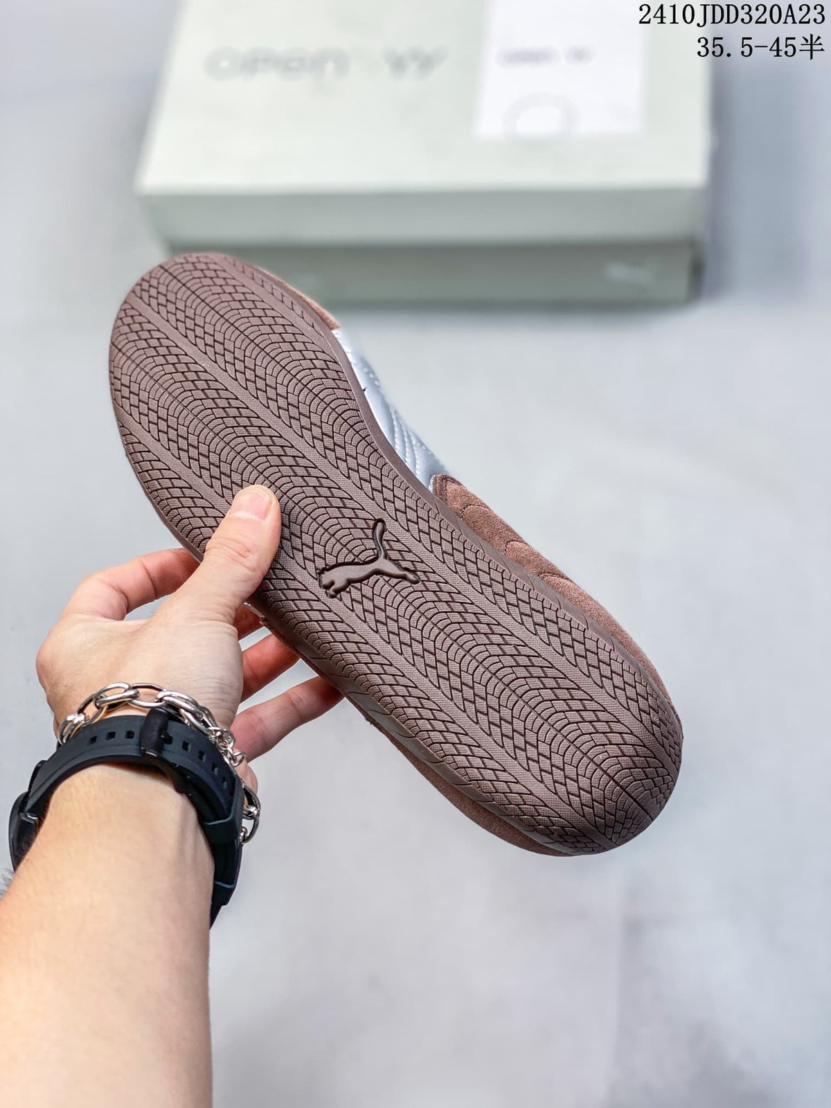 Close-up of the patterned brown outsole on a Puma Speedcat sneaker