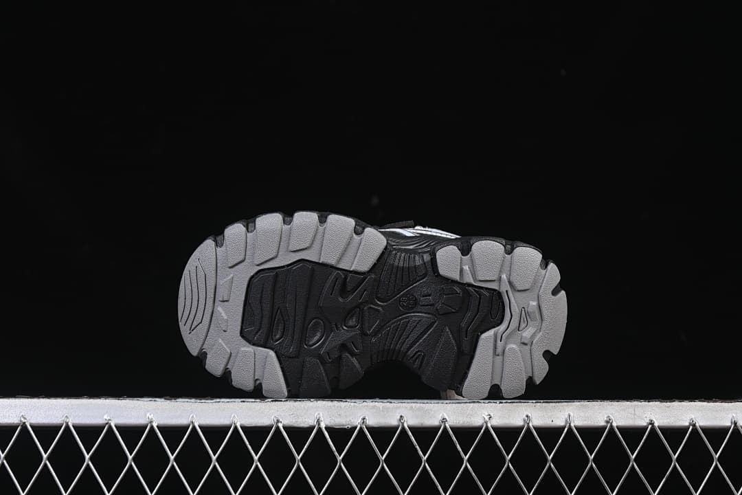 Underside of the sneaker showing the patterned outsole tread.