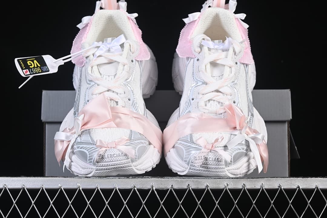 Front view of the pair showing the laces, ribbon details, and sculpted toes.