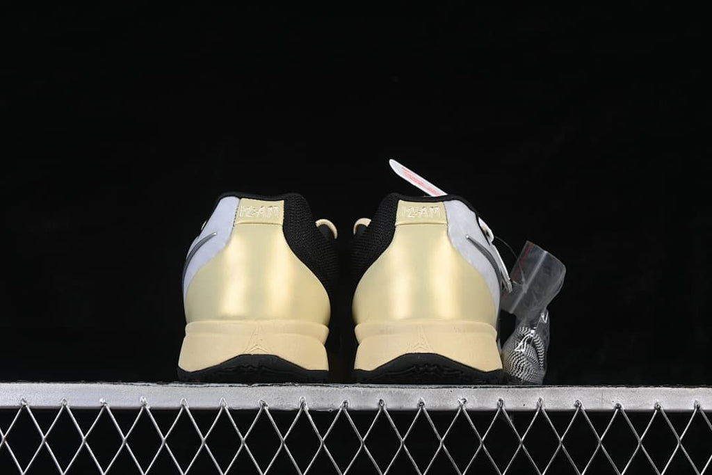 Rear view of both shoes showing their heel panels
