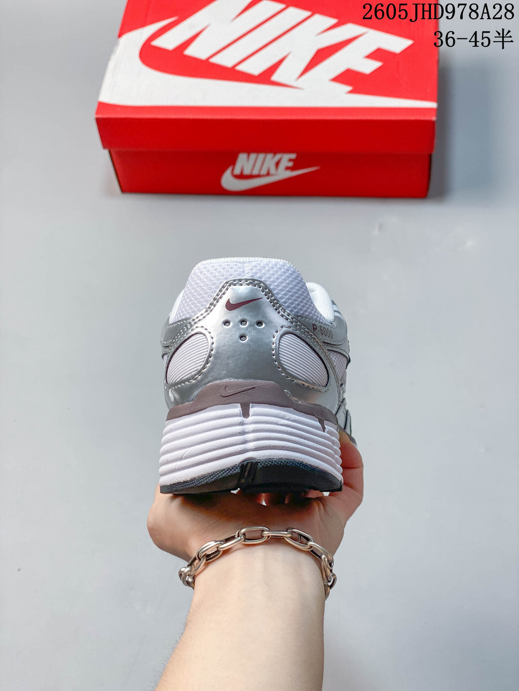 Rear view of the silver and white Nike Initiator shoe