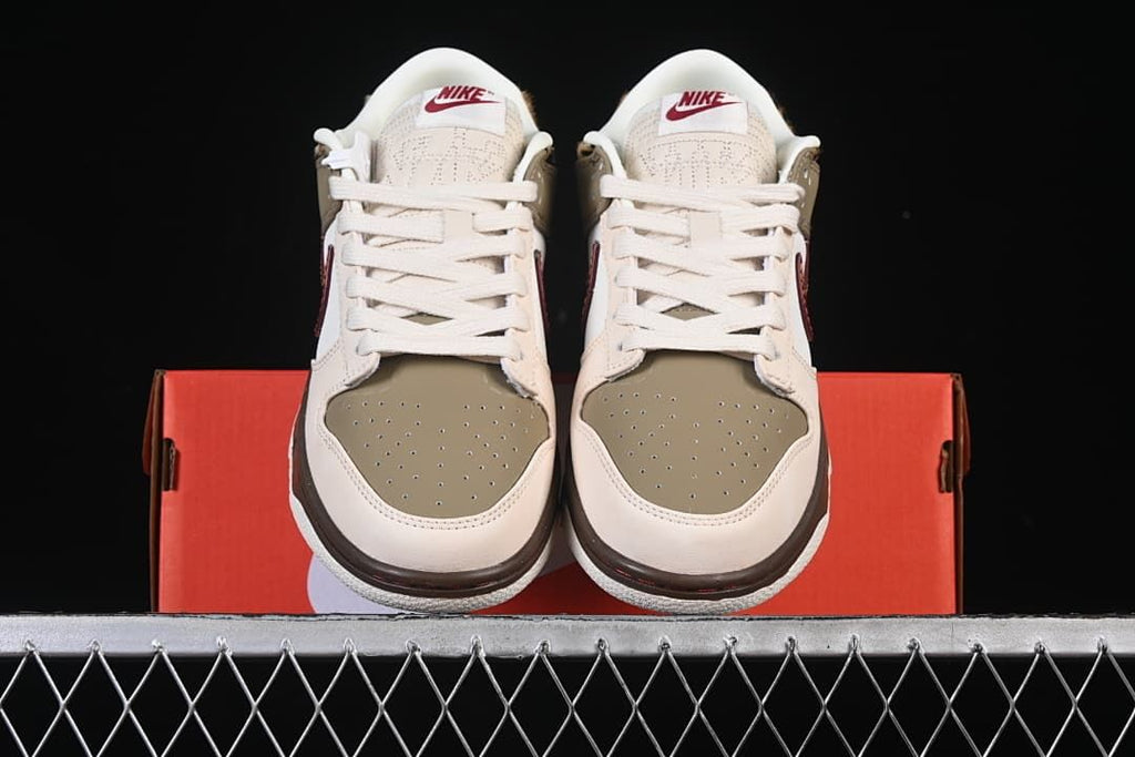 Front view of the pair showing perforated olive toe boxes and cream laces