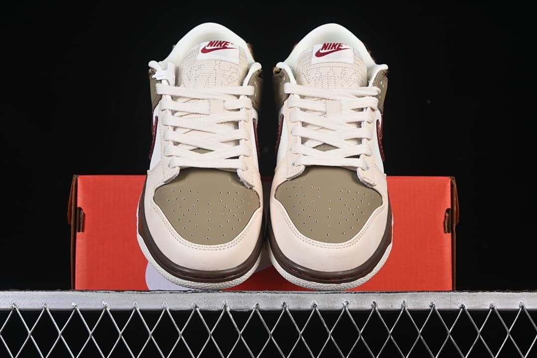 Front view of the pair showing perforated olive toe boxes and cream laces